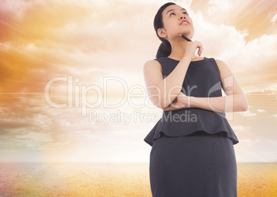 Composite image of thinking asian businesswoman