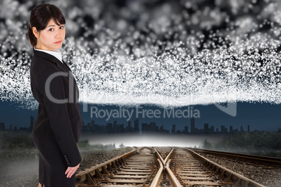 Composite image of serious businesswoman