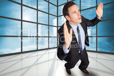 Composite image of businessman posing with arms raised Composite image of businessman posing with arms raised