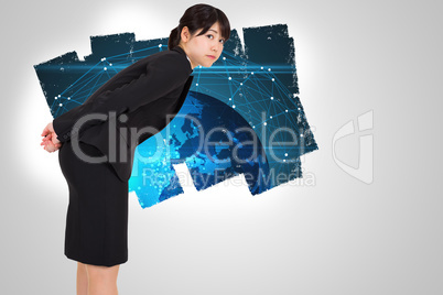 Composite image of serious businesswoman bending