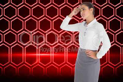 Composite image of worried businesswoman