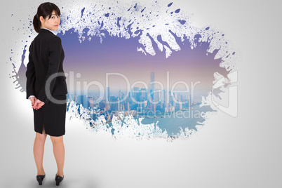 Composite image of serious businesswoman