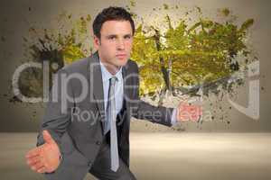 Composite image of businessman posing with hands out