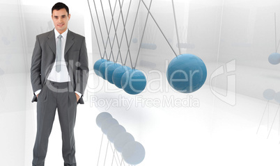 Composite image of businessman with his hands in his pockets