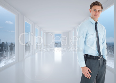 Composite image of serious businessman standing with hand in poc