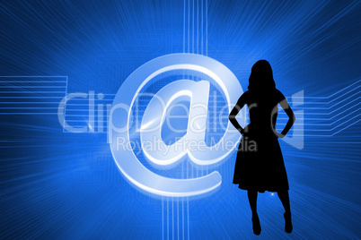 Composite image of glowing at sign on blue background