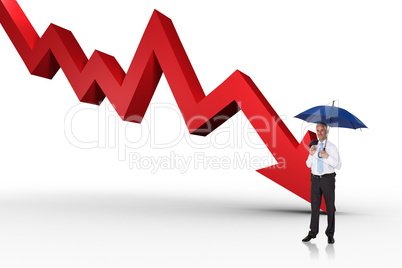 Composite image of happy businessman holding umbrella