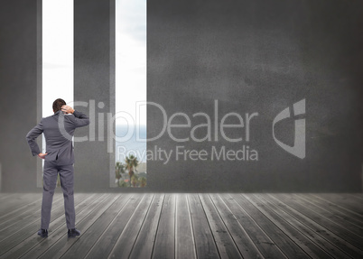 Composite image of thinking businessman scratching head