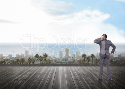 Composite image of thinking businessman scratching head