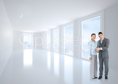 Composite image of business partners with clipboard