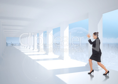 Composite image of angry businesswoman gesturing