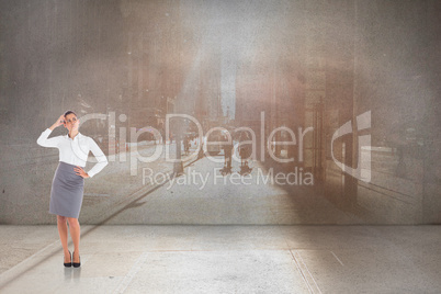 Composite image of focused businesswoman