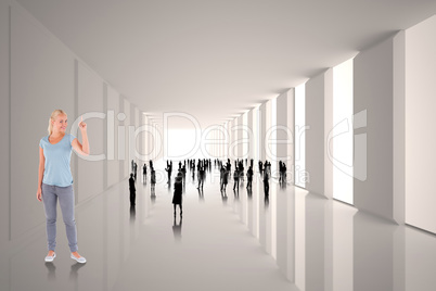 Composite image of charming woman pointing