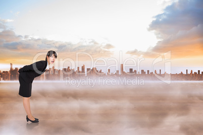 Composite image of surprised businesswoman bending