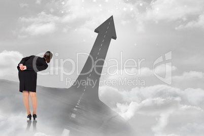 Composite image of businesswoman bending