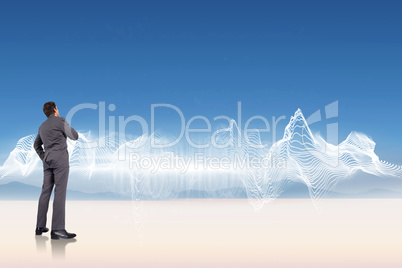 Composite image of thinking businessman with hand on chin