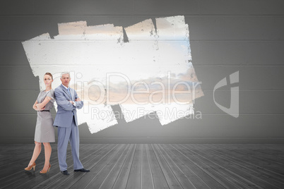 Composite image of serious businessman standing back to back wit