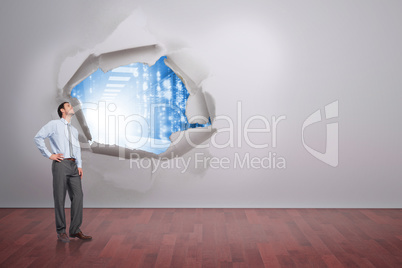 Composite image of smiling businessman with hand on hip