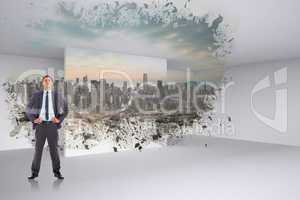 Composite image of serious businessman with hands on hips