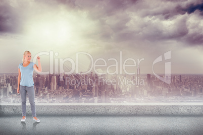 Composite image of charming woman pointing