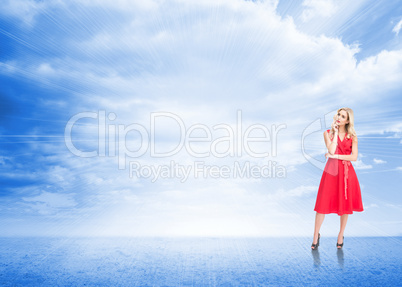 Composite image of thoughtful blonde wearing red dress