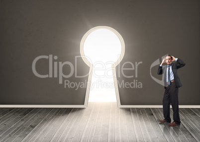 Composite image of stressed businessman with hands on head