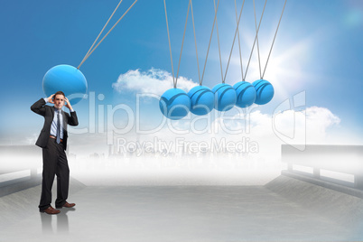 Composite image of stressed businessman with hands on head