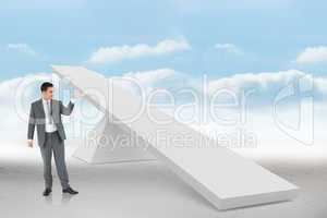 Composite image of businessman looking at what he is presenting