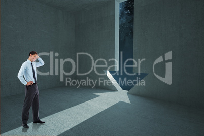 Composite image of thoughtful businessman with hand on head