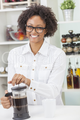 mixed race african american girl making coffee