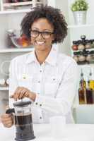 mixed race african american girl making coffee