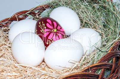 Easter egg in basket.