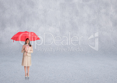 Composite image of attractive businesswoman holding red umbrella