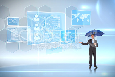 Composite image of peaceful businessman holding blue umbrella