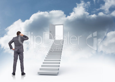 Composite image of thinking businessman scratching head