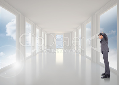 Composite image of thinking businessman scratching head