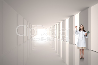 Composite image of smiling doctor pointing