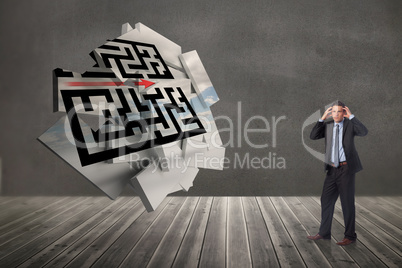 Composite image of stressed businessman with hands on head