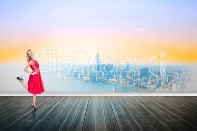 Composite image of smiling blonde standing hands on hips