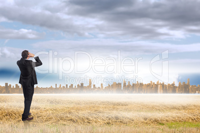 Composite image of stressed businessman with hands on head