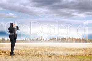 Composite image of stressed businessman with hands on head