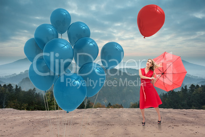 Composite image of elegant blonde holding umbrella