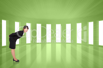 Composite image of surprised businesswoman bending