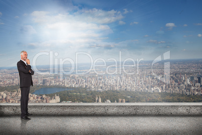 Composite image of happy businessman looking away