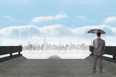 Composite image of rear view of classy businessman holding grey