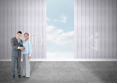 Composite image of business partners with clipboard