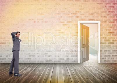 Composite image of thinking businessman scratching head