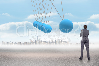 Composite image of thoughtful businessman holding pen