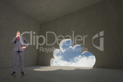 Composite image of thinking businessman touching chin