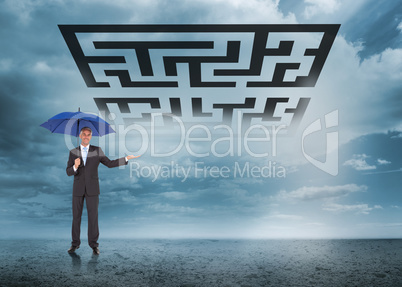 Composite image of peaceful businessman holding blue umbrella